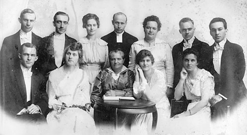 The John Nilsson Alexis Family, July, 1917 Front row: Joseph Alexis, Magda (Joseph) Alexis, Ingrid Alexis (mother), Helen (Oscar) Alexis, Olga (Gerhard) Alexis Back row: Crispin Alexis, Carl Alexis, Tekla Alexis, Rev. Emil Valberg, Theresia (Emil) Valberg (nee Alexis), Oscar Alexis, Gerhard Alexis Not pictured: Rev. John Nilsson Alexis (father), deceased 1912